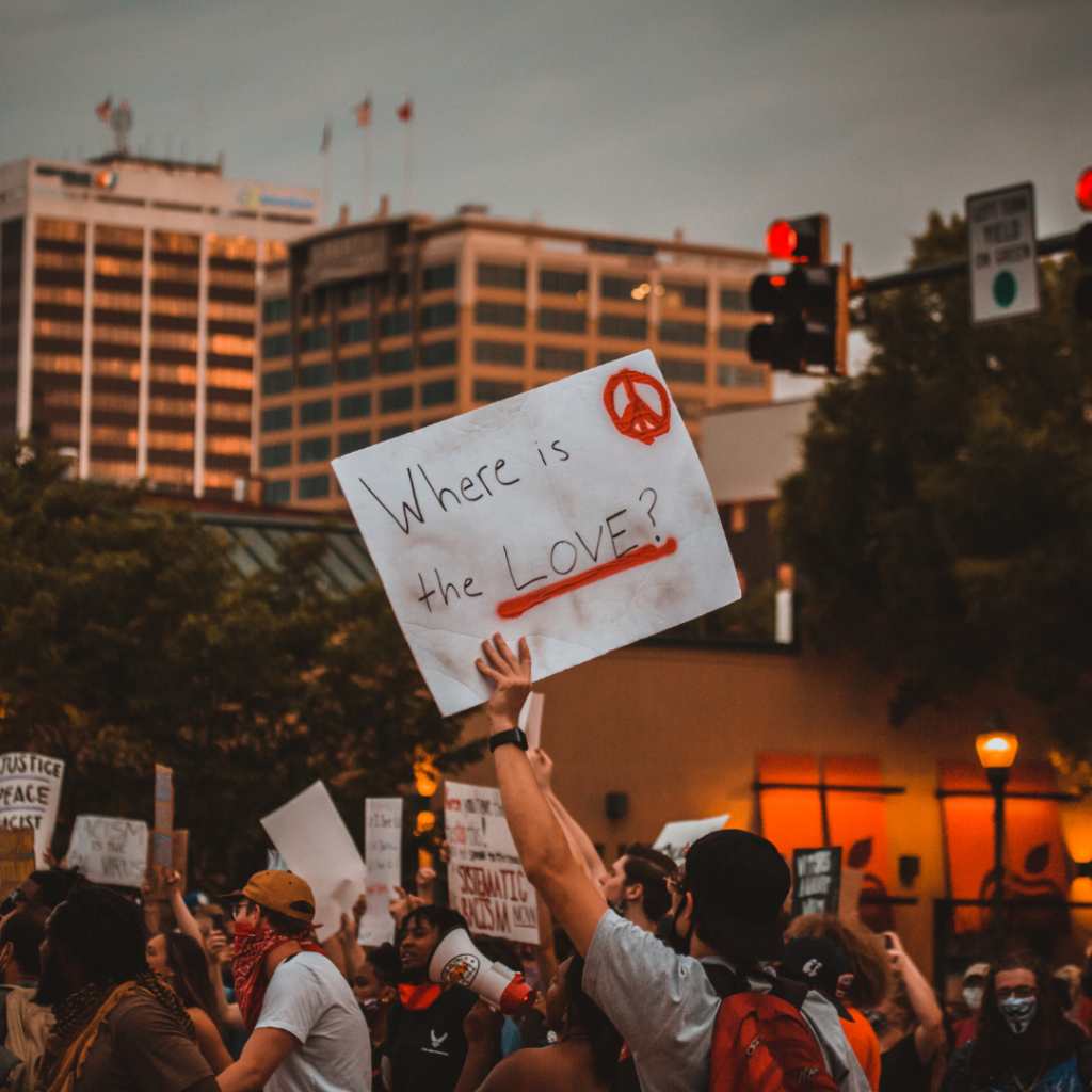 protest and "where is love" sign